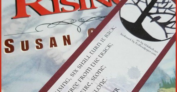 A Redhead Paper bookmark with The Dark Is Rising by Susan Cooper