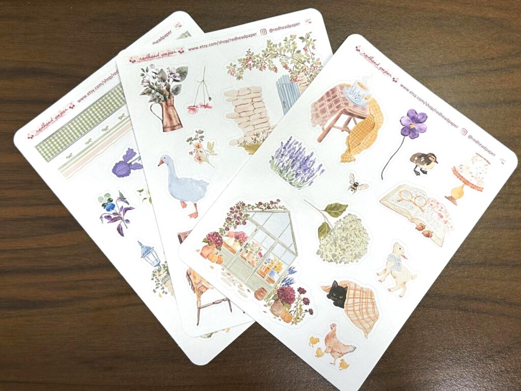 Image of three sticker sheets with stickers of baby animals, spring flowers, and more